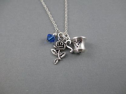 Small silver rose and tea cup charms on a silver chain.